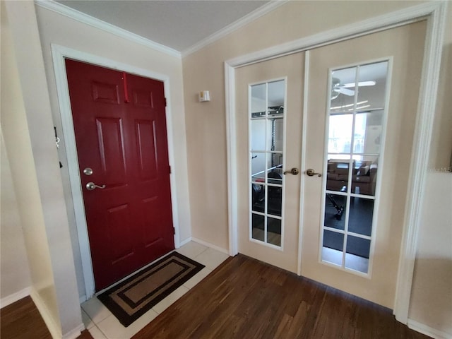 doorway with hardwood / wood-style flooring, french doors, and ornamental molding