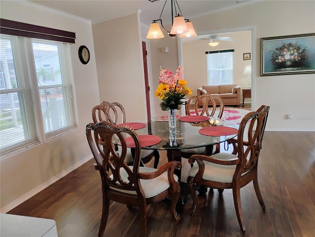 dining room featuring dark hardwood / wood-style flooring, ceiling fan, and ornamental molding