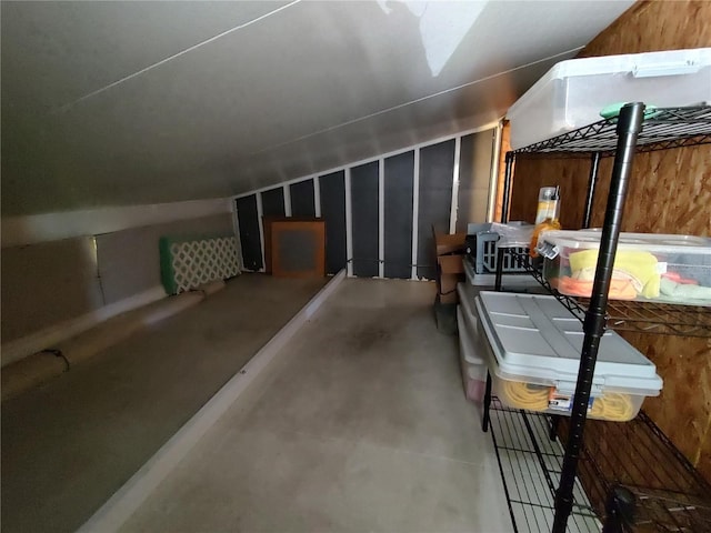 additional living space featuring concrete flooring