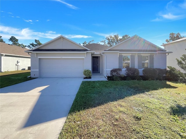 single story home with a front yard and a garage