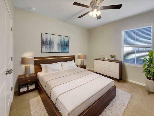 bedroom featuring ceiling fan and carpet floors