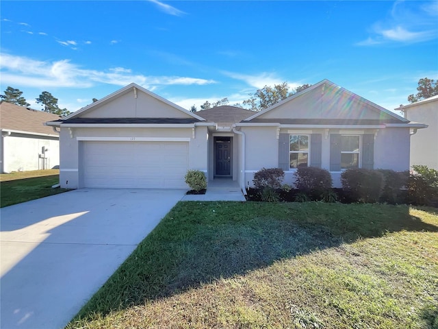 ranch-style home with a front lawn and a garage