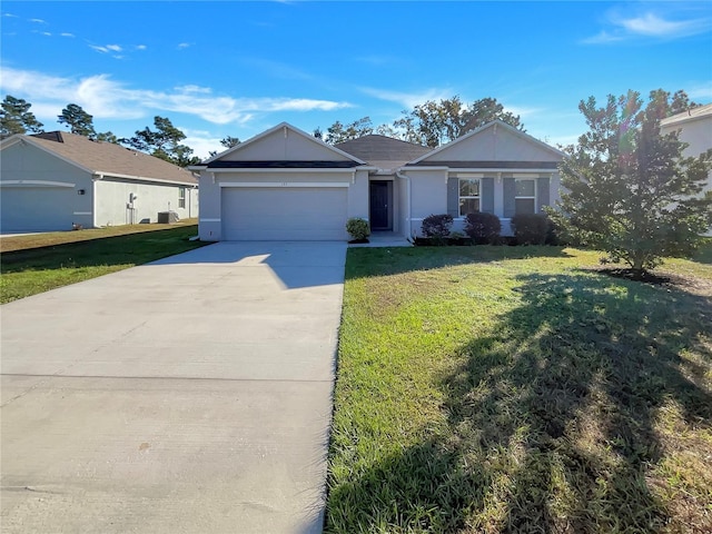 ranch-style home with a garage and a front yard