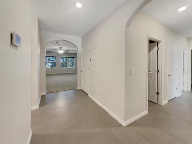 corridor with light tile patterned floors