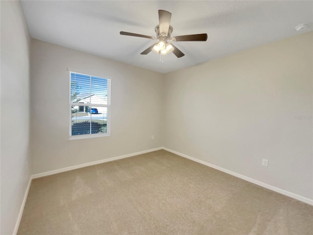 carpeted empty room with ceiling fan