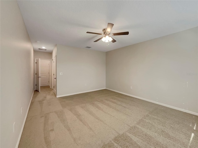 127 Hickory Crse, Ocala, FL 34472 - unfurnished room with light carpet, a ceiling fan, and baseboards