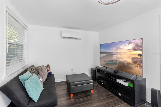 living room featuring dark hardwood / wood-style flooring and an AC wall unit