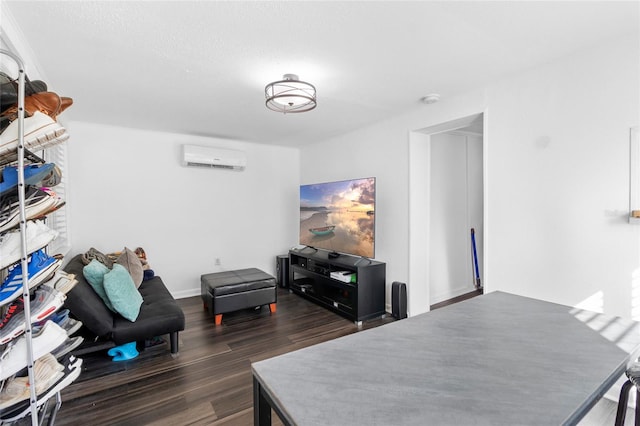 office space with a wall mounted air conditioner and dark wood-type flooring