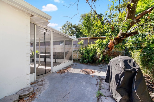 view of patio / terrace with a sunroom