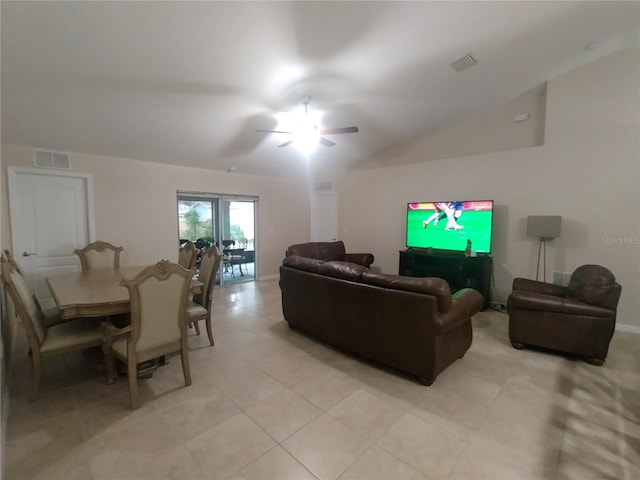 living room featuring lofted ceiling, a ceiling fan, and visible vents