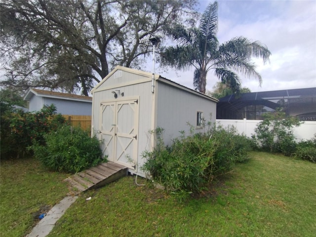 view of shed with fence