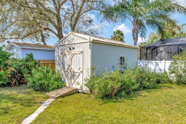 view of shed with a fenced backyard