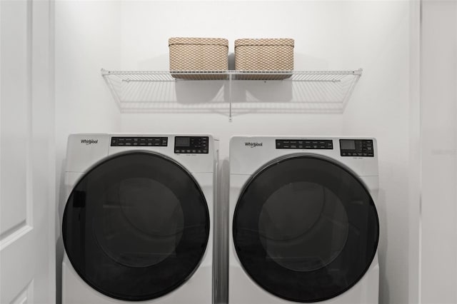 laundry room featuring washing machine and dryer