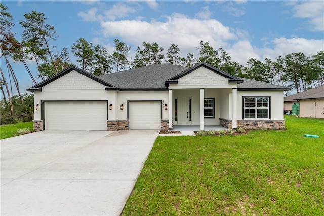 view of front of property with a front lawn, a porch, and a garage