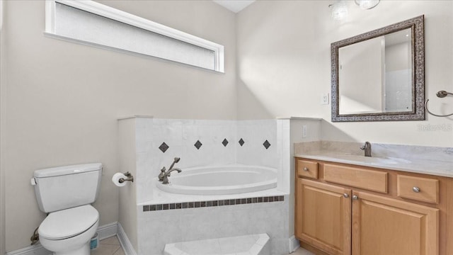 bathroom featuring tile patterned floors, tiled bath, vanity, and toilet