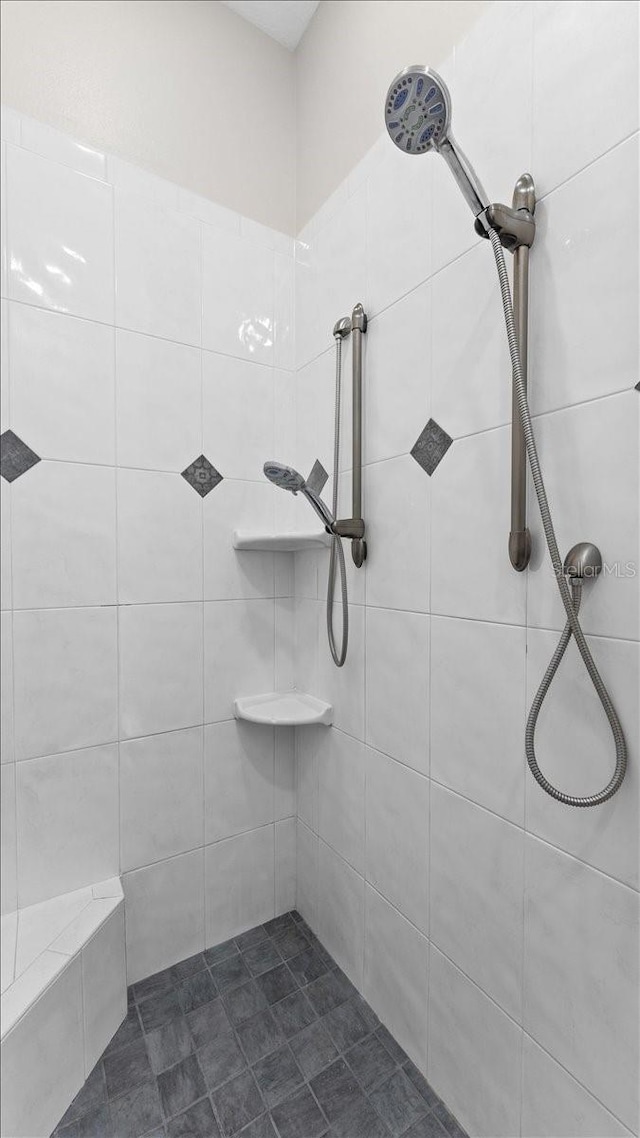 bathroom with tiled shower