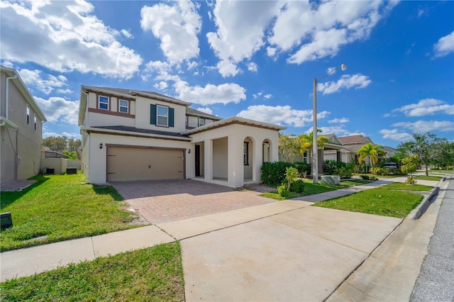 view of front of home featuring a garage and a front yard