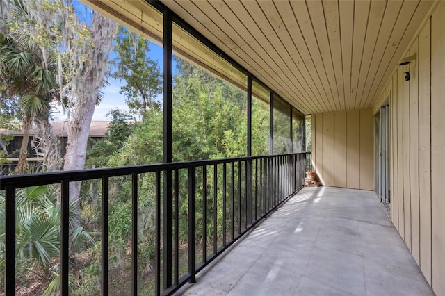 unfurnished sunroom featuring wood ceiling