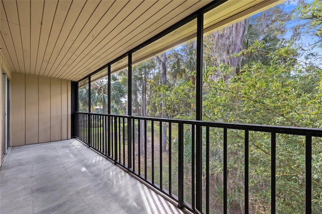 unfurnished sunroom featuring wood ceiling