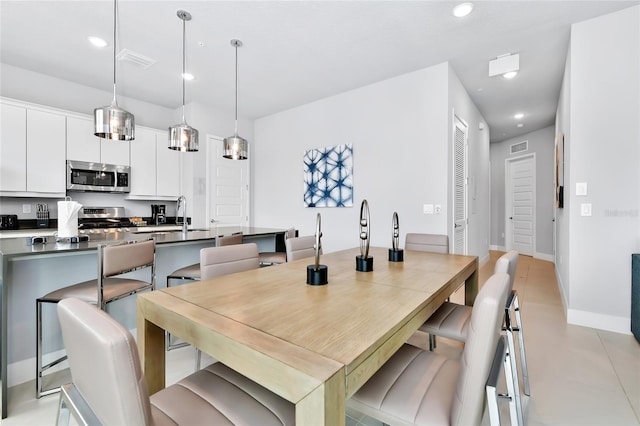 dining room featuring sink