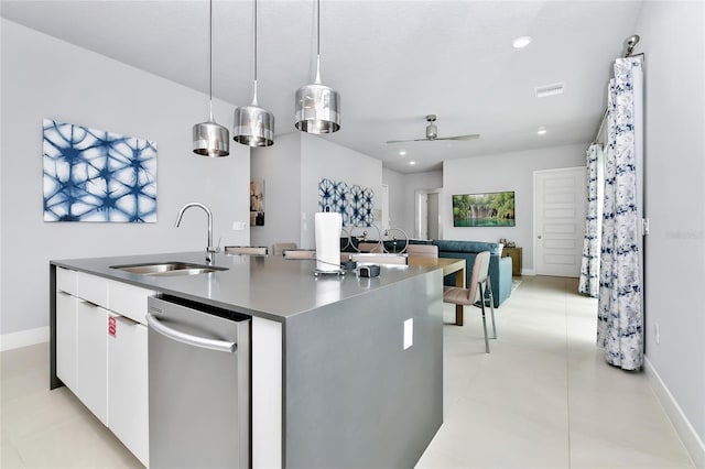 kitchen with sink, pendant lighting, a center island with sink, dishwasher, and white cabinetry