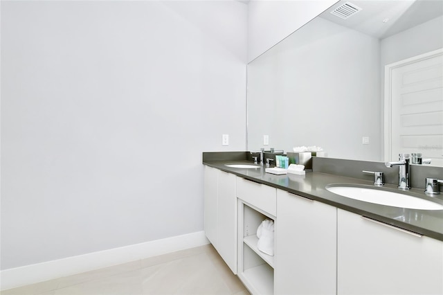 bathroom with tile patterned flooring and vanity