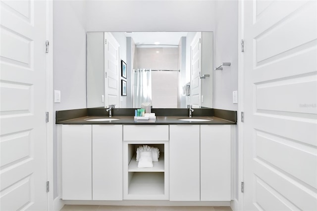 bathroom featuring vanity and a shower with shower door