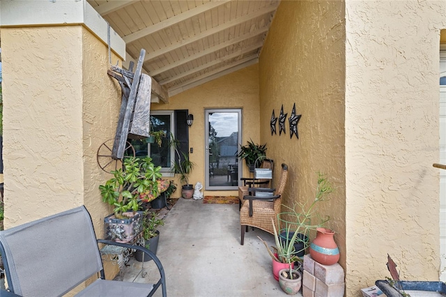 doorway to property with a patio