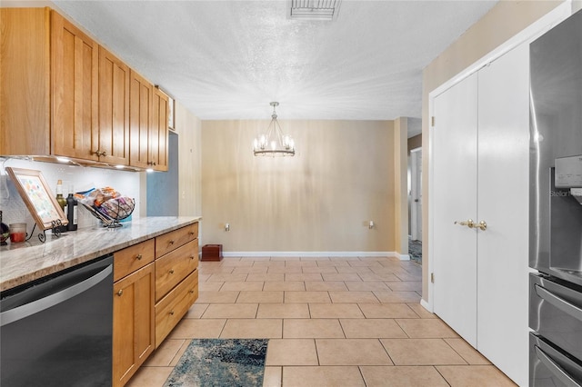 kitchen featuring light stone countertops, stainless steel dishwasher, an inviting chandelier, hanging light fixtures, and light tile patterned flooring