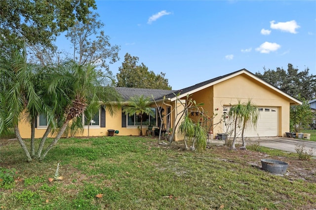 ranch-style house featuring a garage and a front lawn