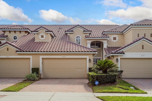 mediterranean / spanish-style house featuring a garage