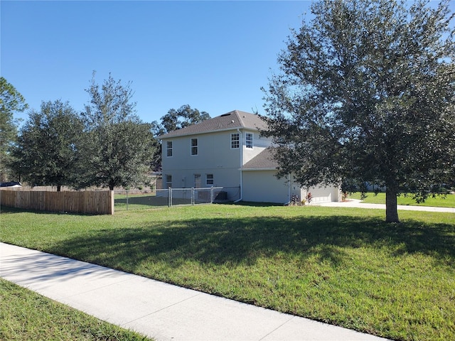 view of property exterior featuring a yard and a garage