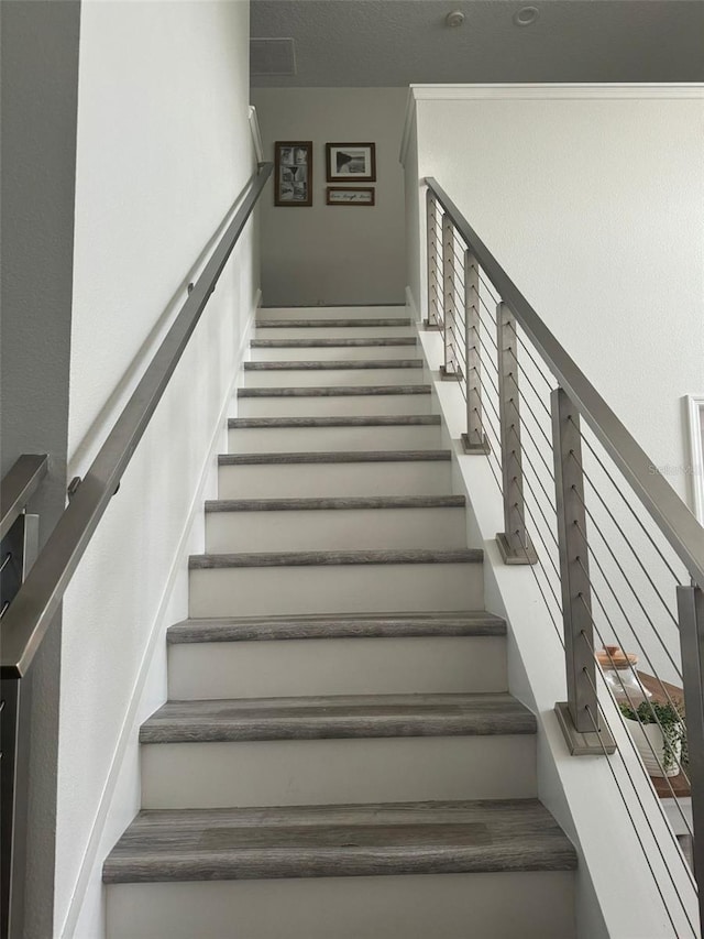 stairs featuring a wealth of natural light