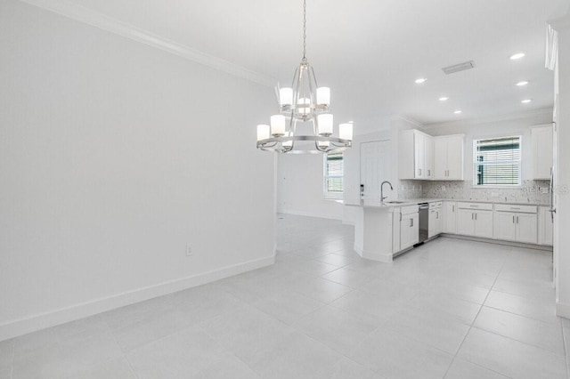 kitchen featuring decorative backsplash, dishwasher, crown molding, and white cabinets