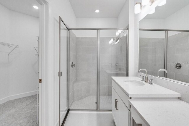 bathroom featuring vanity and walk in shower