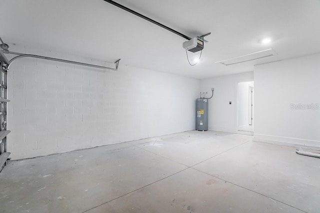 garage with a garage door opener and electric water heater