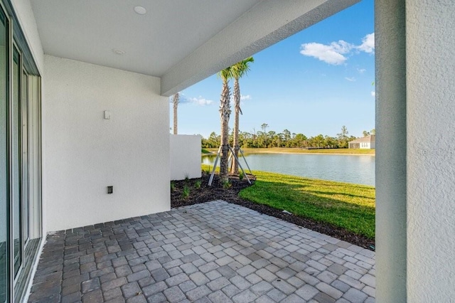 view of patio featuring a water view