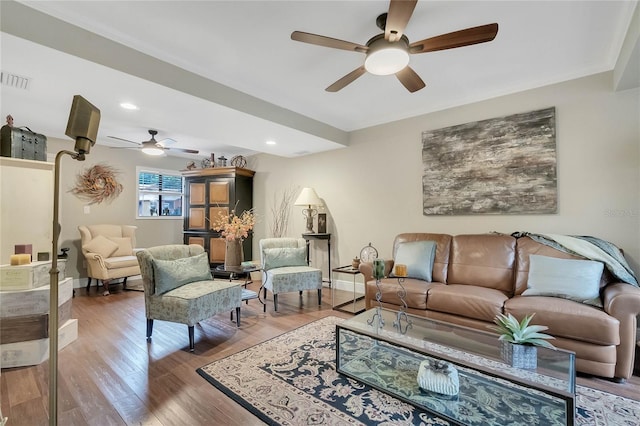 living room featuring ceiling fan, wood-type flooring, and ornamental molding