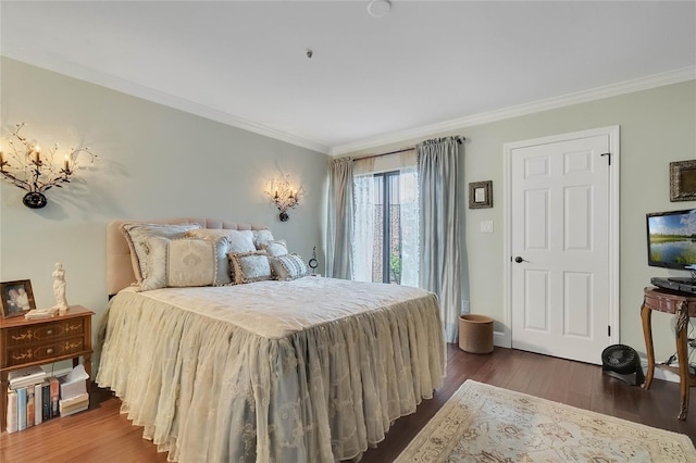 bedroom featuring crown molding and dark hardwood / wood-style flooring