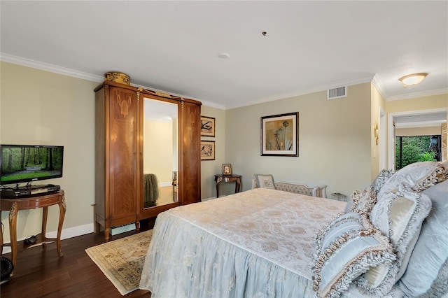 bedroom featuring crown molding and dark wood-type flooring