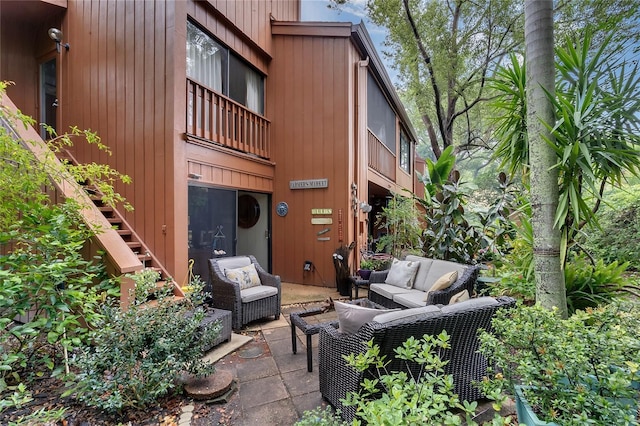 view of patio featuring an outdoor living space and a balcony