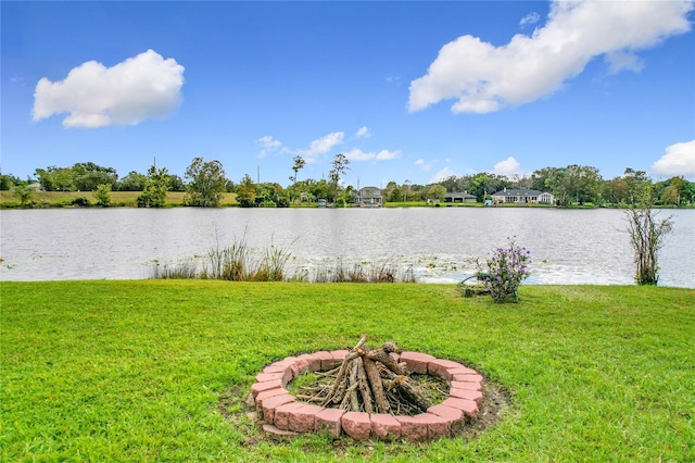 property view of water featuring an outdoor fire pit