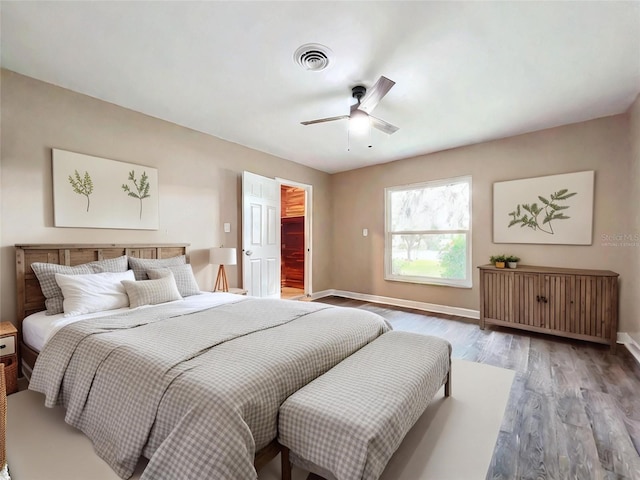 bedroom with hardwood / wood-style floors and ceiling fan