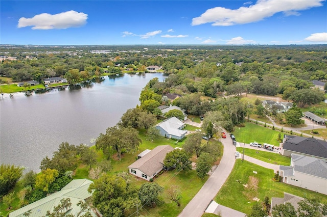 bird's eye view featuring a water view and a forest view