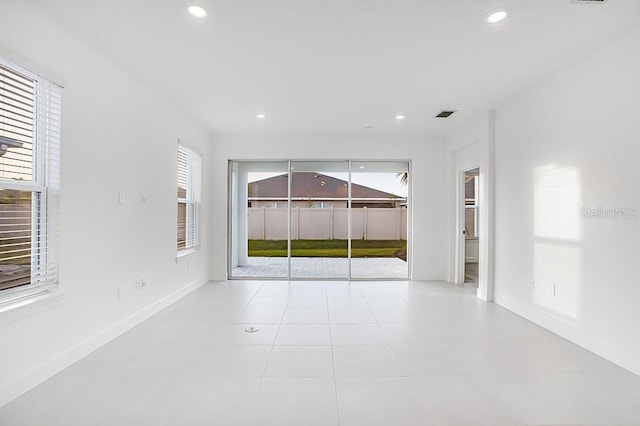 spare room with light tile patterned floors