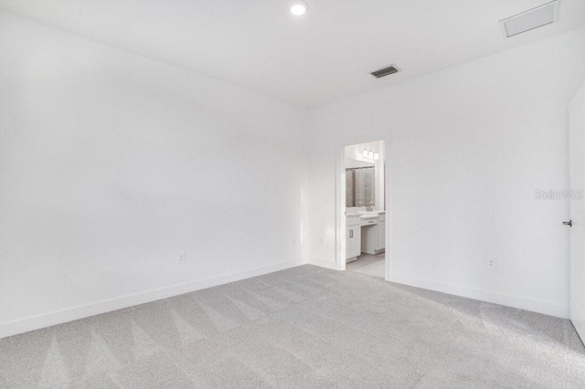 spare room with light carpet