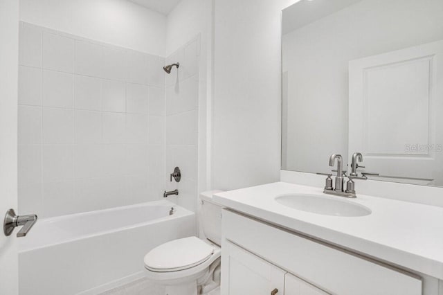 full bathroom featuring toilet, vanity, and tiled shower / bath