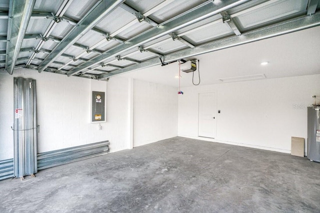 garage featuring electric panel, a garage door opener, and water heater