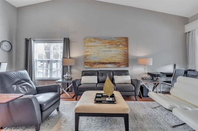 living room with hardwood / wood-style flooring and lofted ceiling