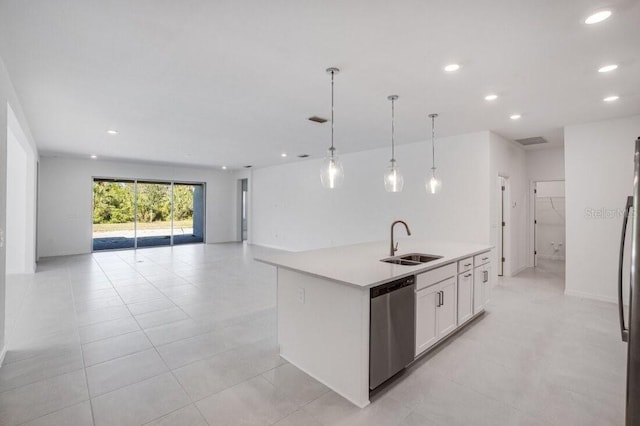 kitchen with sink, white cabinets, pendant lighting, a kitchen island with sink, and appliances with stainless steel finishes